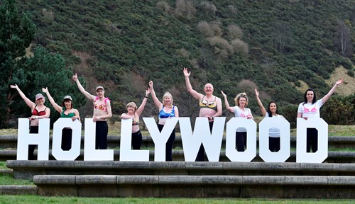 Image of Walkers holding ‘Hollywood’ letters in bras